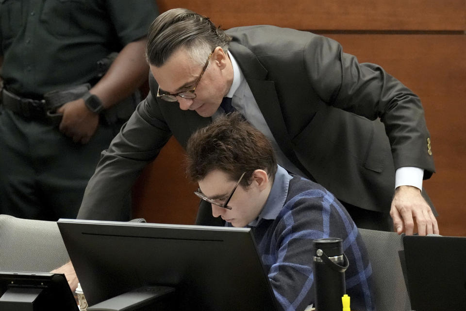 Capital defense attorney Casey Secor, standing, and Marjory Stoneman Douglas High School shooter Nikolas Cruz are shown during the penalty phase of Cruz's trial at the Broward County Courthouse in Fort Lauderdale, Fla., Monday, Aug. 29, 2022. Cruz previously plead guilty to all 17 counts of premeditated murder and 17 counts of attempted murder in the 2018 shootings. (Amy Beth Bennett/South Florida Sun Sentinel via AP, Pool)