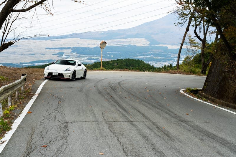 Tire marks tip you off that this is a road beloved by drifters and togue fans.