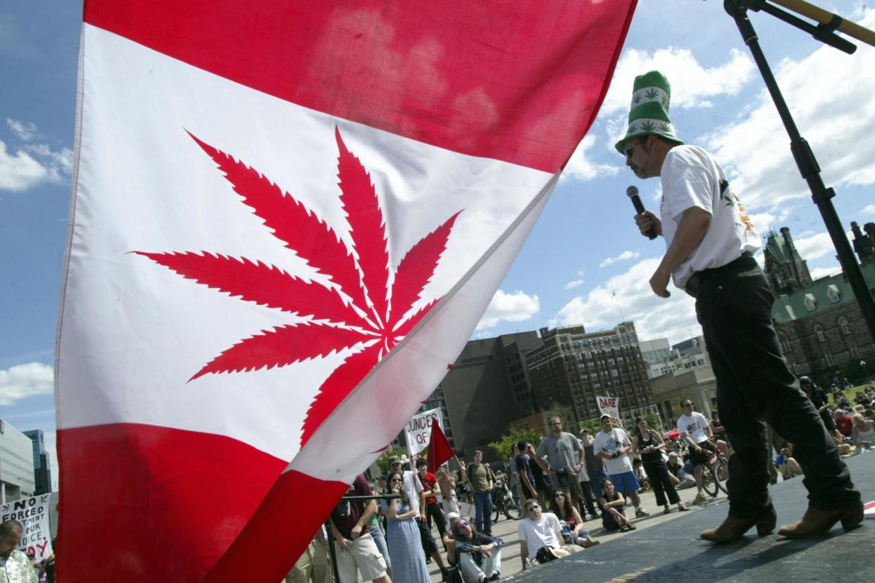 Rally cry: An activist speaks at a pro-legalisation rally in Ottawa: Getty Images