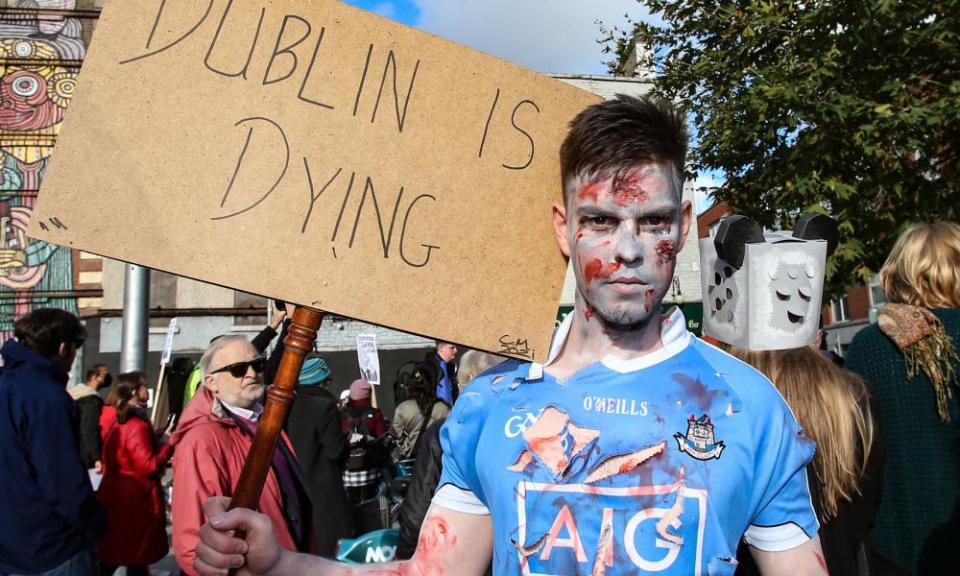 People gather at Smithfield in Dublin to protest over plans to build a hotel on the site of The Cobblestone pub.