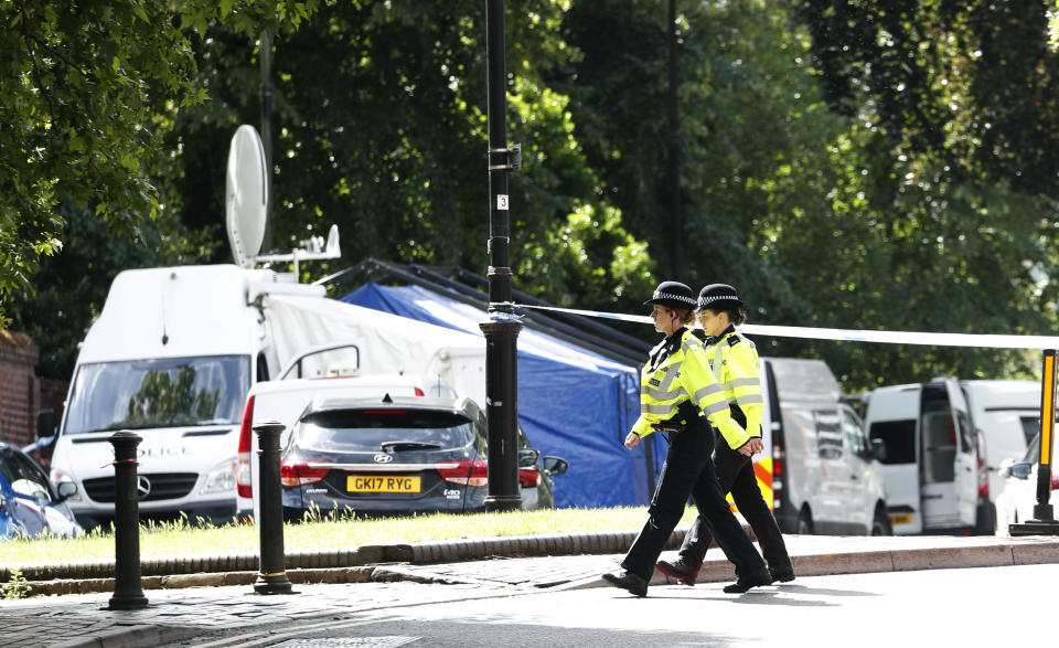 FILE - Police patrol outside Forbury Gardens, a day after a multiple stabbing attack in the gardens in Reading, England, Sunday June 21, 2020. Knife crimes are on the rise in England and Wales, and a string of deadly attacks in recent years has stoked public anxiety and led to calls for the government to do more. (AP Photo/Alastair Grant, File)