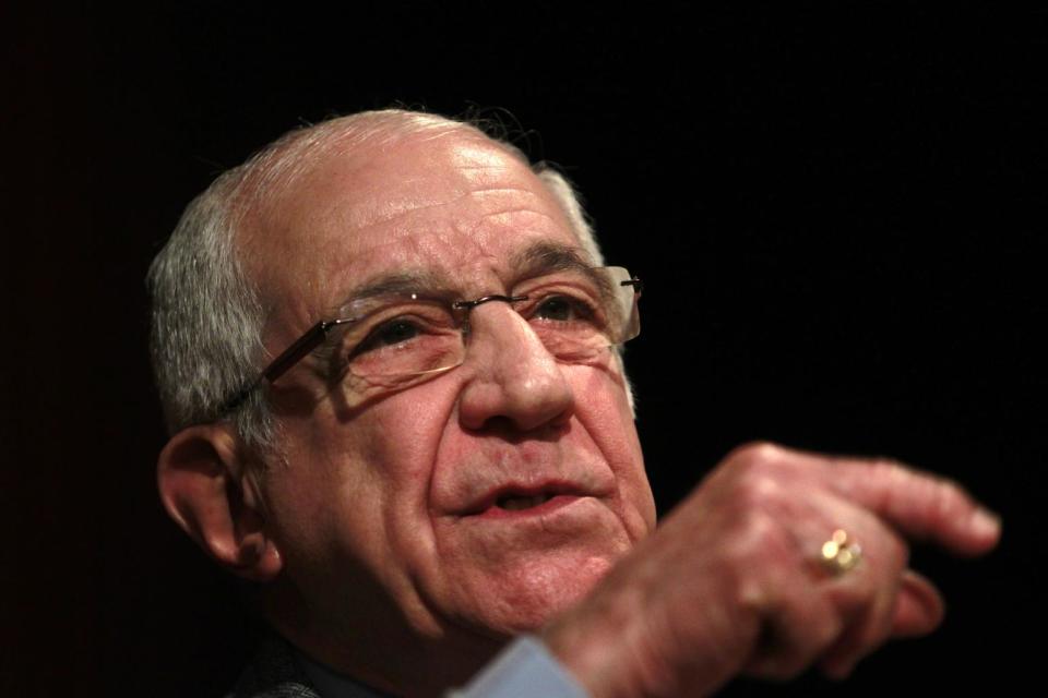 In this picture shot April 23 2014, Otelo Saraiva de Carvalho gestures during a conference in Lisbon. "Many people are feeling very cheated," said Otelo Saraiva de Carvalho, a former army captain who masterminded the April 25 1974 pre-dawn military takeover. "What we're living through now, it's like it's signing the death warrant of the hopes and values of (the revolution)." (AP Photo/Francisco Seco)