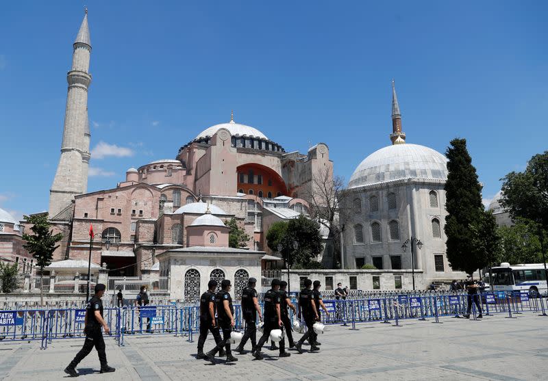 Police officers walk in front of Hagia Sophia, or Ayasofya-i Kebir Camii, in Istanbul