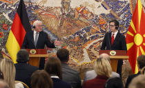 German President Frank-Walter Steinmeier, left, speaks, during a joint news conference with North Macedonia's President Stevo Pendarovski at the presidential palace in Skopje, North Macedonia, Tuesday, Nov. 29, 2022. Steinmeier is on a two-day official visit to North Macedonia. (AP Photo/Boris Grdanoski)