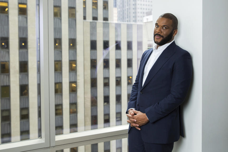 FILE - In this Nov. 16, 2017, file photo, actor-filmmaker and author Tyler Perry poses for a portrait in New York. Perry is looking to reopen his 330-acre Atlanta-based mega studio soon, but other studios in Georgia are anxiously waiting for Hollywood's green light to return back to work. Perry plans on restarting production at the Tyler Perry Studios complex in July, making it one of the first studios to domestically reopen after production was halted a few months ago to combat the spread of the coronavirus. (Photo by Amy Sussman/Invision/AP, File)