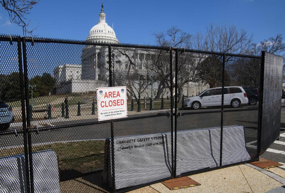 A sign is seen on security fencing surrounding the US Capitol grounds in Washington, DC, on February 28, 2022, ahead of tomorrow's State of the Union speech by US President Joe Biden. - Embroiled in the most severe US-Russia crisis since the Cold War, President Joe Biden will take on a no less difficult domestic challenge during his State of the Union address: restoring Americans' optimism. (Photo by Nicholas Kamm / AFP) (Photo by NICHOLAS KAMM/AFP via Getty Images)