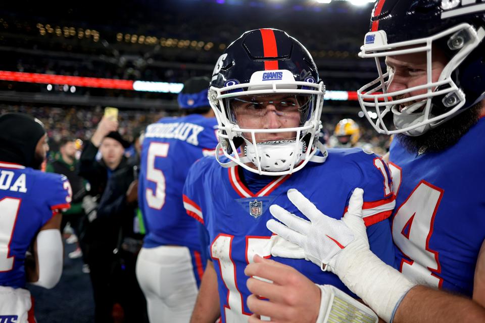 New York Giants quarterback Tommy DeVito (15) celebrates on the field with teammates after playing against the Green Bay Packers in an NFL football game, Monday, Dec. 11, 2023, in East Rutherford, N.J. (AP Photo/Adam Hunger)
