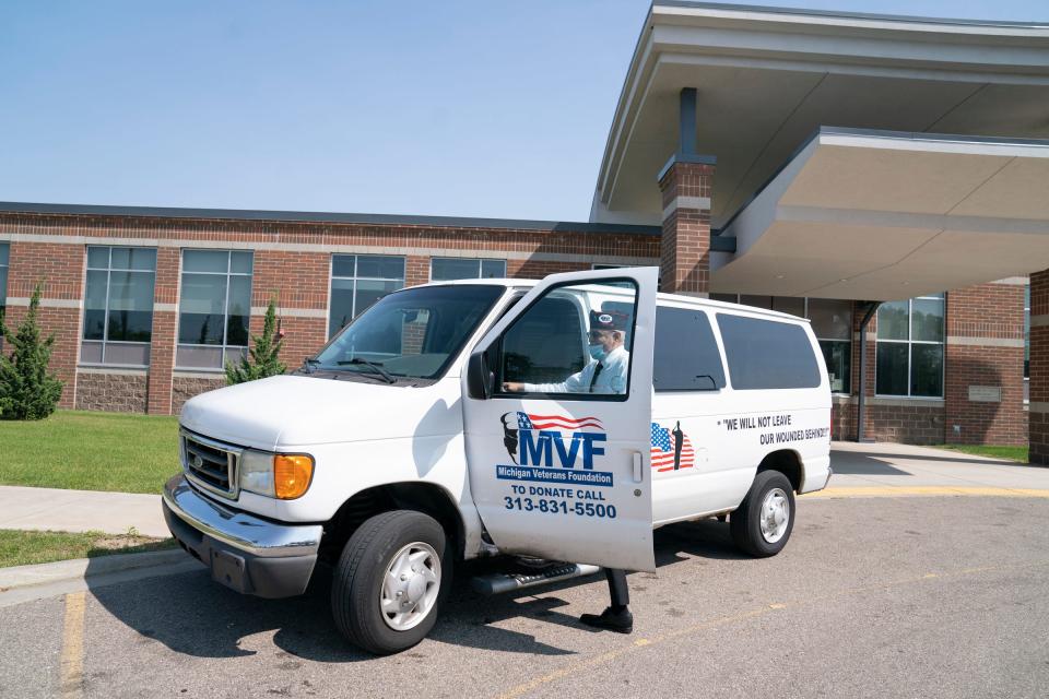Robert Castillo, Resource Development Deputy for the Michigan Veterans Foundation jumps in the MVF van to help transport homeless veterans in Detroit on Tuesday, Aug. 29, 2023.