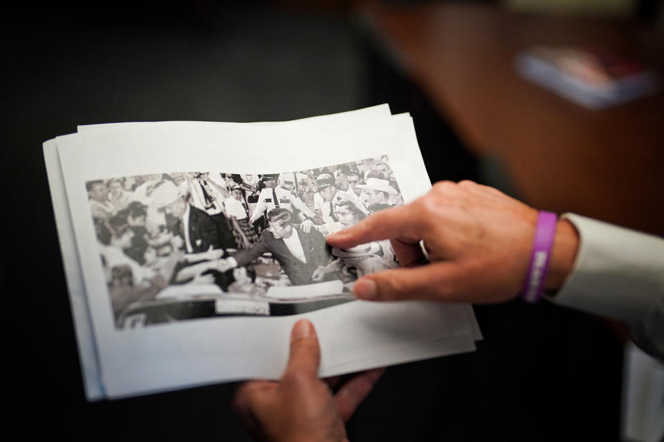 Rep Roger Williams, R-Texas, shows a picture of President John F. Kennedy’s motorcade from the day he was assassinated. (Frank Thorp V / NBC News)