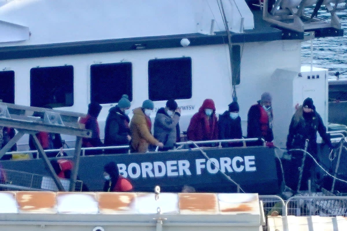 A group of people thought to be migrants are brought in to Dover (PA) (PA Wire)