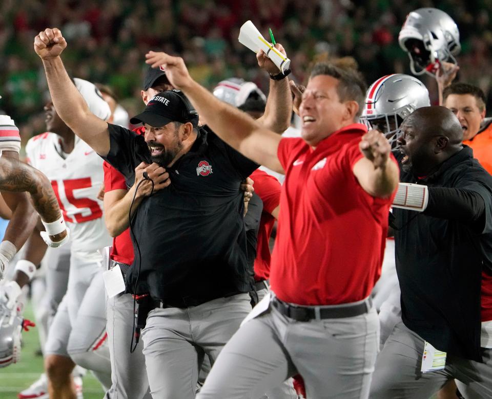 Sep 23, 2023; South Bend, Indiana, USA; Ohio State Buckeyes head coach Ryan Day celebrates Chip Trayanum (19) game winning rushing touchdown against Notre Dame Fighting Irish during the fourth quarter of their game at Notre Dame Stadium.