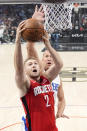 Houston Rockets center Jock Landale, left, shoots as Los Angeles Clippers center Mason Plumlee defends during the first half of an NBA basketball game Sunday, April 14, 2024, in Los Angeles. (AP Photo/Mark J. Terrill)