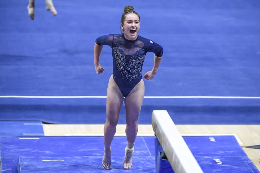 UCLA's Norah Flatley celebrates after her beam routine. She scored a team-high 9.875 in her season debut in the event.