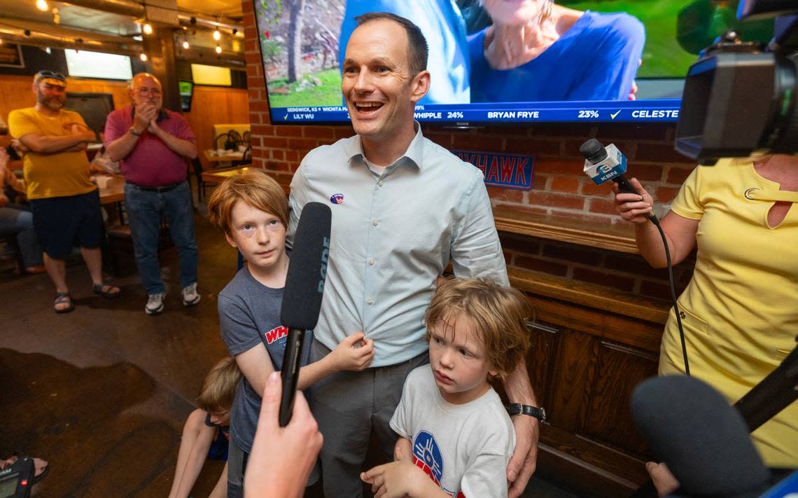 Wichita Mayor Brandon Whipple is surrounded by his children on primary election night in August. He faces former local TV reporter Lily Wu on Nov. 7.