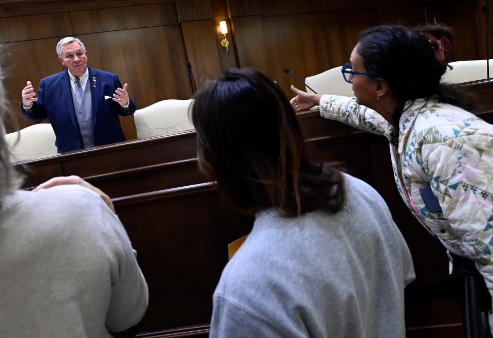 Tennessee Rep. John Ragan, R-Oak Ridge, talks with concerned residents after a joint working group at the Cordell Hull State Office Building on Wednesday, Nov. 8, 2023, in Nashville, Tenn. Lawmakers are considering rejecting $1.8 billion in federal education funding and replacing them with state money.