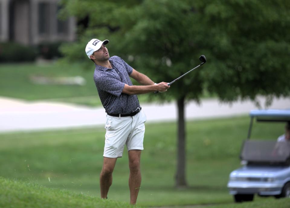 Jake Erickson chips onto the No. 7 green during the final round of the Men's City golf tournament at Panther Creek Country Club on Sunday, August 6, 2023.