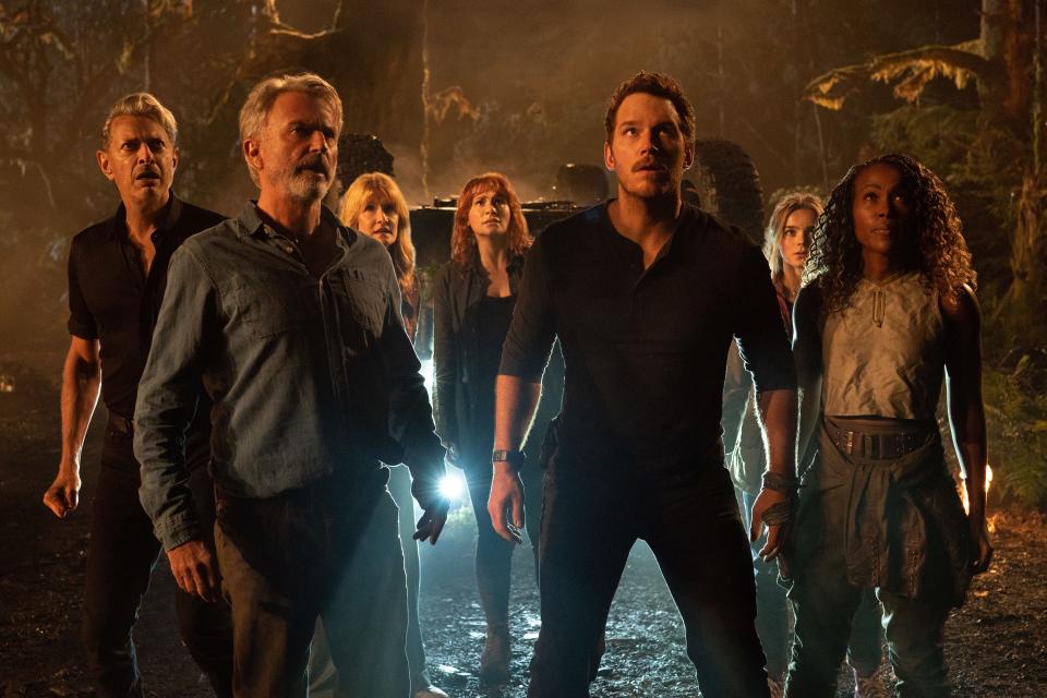 Returning characters, from left, Ian Malcolm (Jeff Goldblum), Alan Grant (Sam Neill) and Ellie Sattler (Laura Dern) face down a Giganotosaurus alongside Claire Dearing (Bryce Dallas Howard), Owen Grady (Chris Pratt), Maisie Lockwood (Isabella Sermon) and Kayla Watts (DeWanda Wise) in "Jurassic World Dominion."