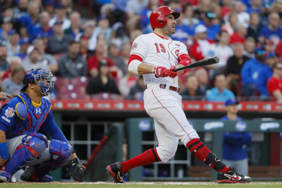 Cincinnati Reds' Joey Votto watches his solo home run off Chicago Cubs starting pitcher Kyle Hendricks during the fourth inning of a baseball game Tuesday, May 14, 2019, in Cincinnati. (AP Photo/John Minchillo)