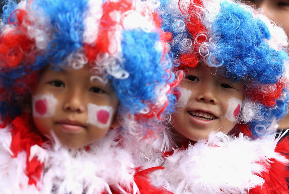 COVENTRY, ENGLAND - JULY 28: Japan fans show their support during the Women's Football first round Group F Match of the London 2012 Olympic Games between Japan and Sweden at City of Coventry Stadium on July 28, 2012 in Coventry, England. (Photo by Quinn Rooney/Getty Images)