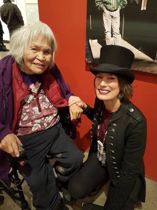 Sʔímlaʔxʷ, also known as Michele Johnson, sits beside the late elder Sarah Peterson, left, who made all the curriculum at the Syilx Language House possible. Sʔímlaʔxʷ says Indigenous languages that are critically endangered need funding in order to bring adults and children to fluency. (Submitted by Sʔímlaʔxʷ Michele Johnson - image credit)