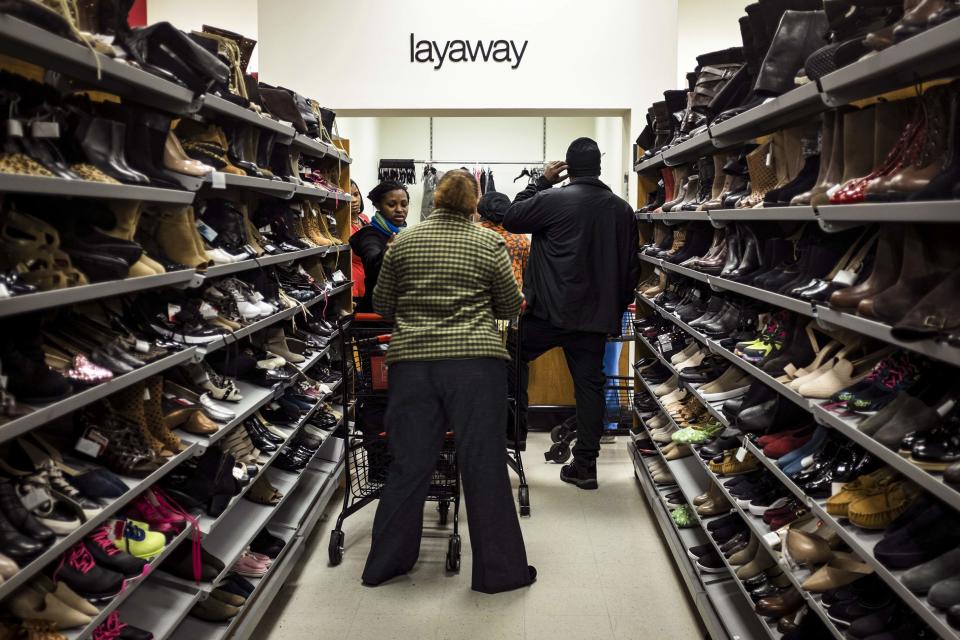 Black Friday shoppers line up at a layaway counter at a TJ Maxx store in Alexandria, Virginia. (REUTERS/James Lawler Duggan)