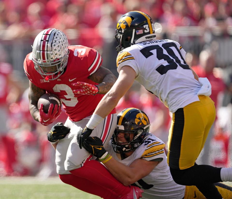 Ohio State running back Miyan Williams runs the ball against Iowa.