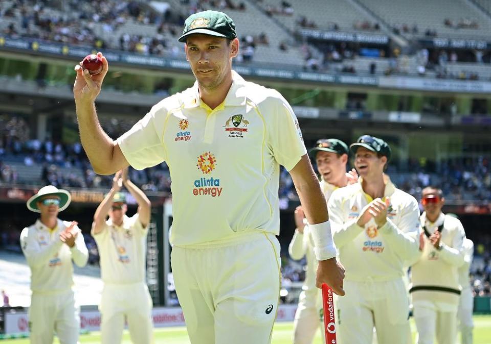 Scott Boland holds the ball aloft after his remarkable spell in Melbourne