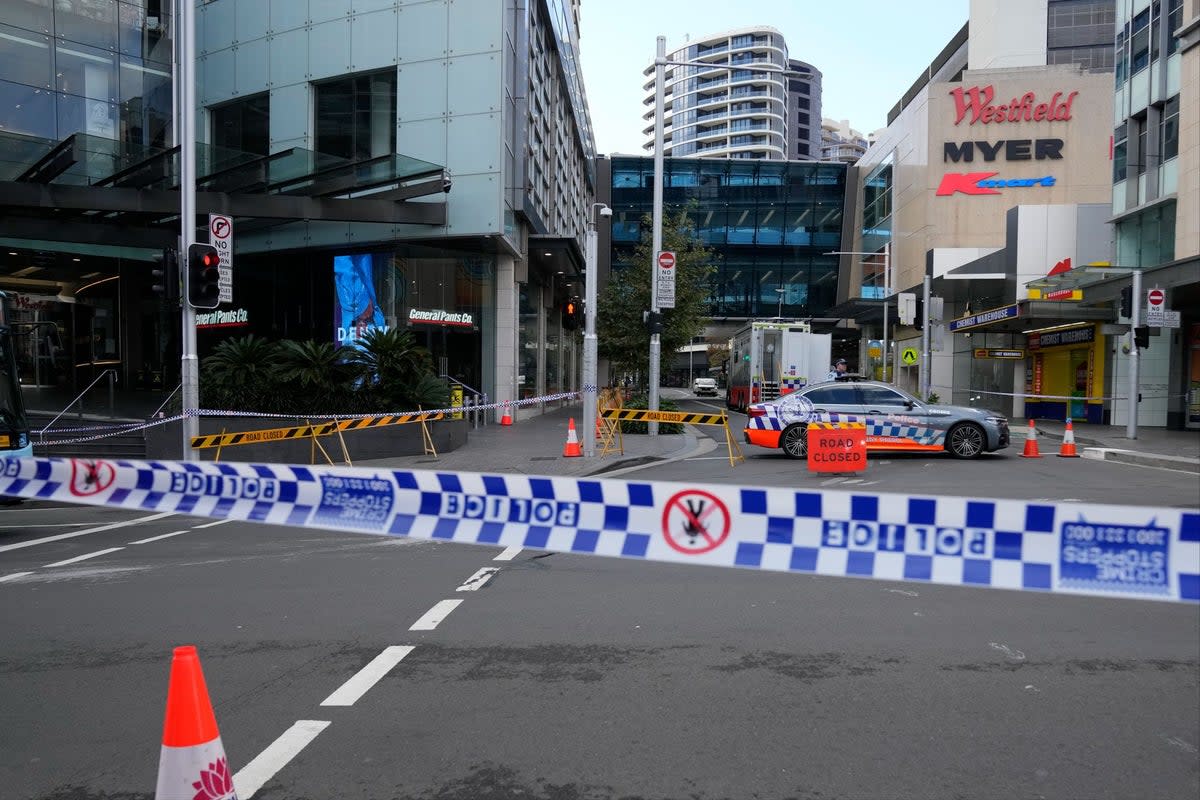 Police block a street near a crime scene at Bondi Junction in Sydney (Rick Rycroft / AP)