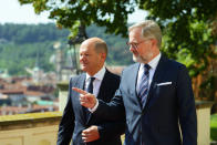 FILE - Czech Republic's Prime Minister Petr Fiala, right, welcomes German Chancellor Olaf Scholz on his visit to Prague, Czech Republic, Monday, Aug. 29, 2022. Leaders from more than 40 countries will gather Thursday, Oct. 6, 2022, in Prague, to launch a "European Political Community" aimed at boosting security and economic prosperity across the continent, but critics claim the new forum is an attempt to put the brakes on European Union enlargement. (AP Photo/Petr David Josek, File)