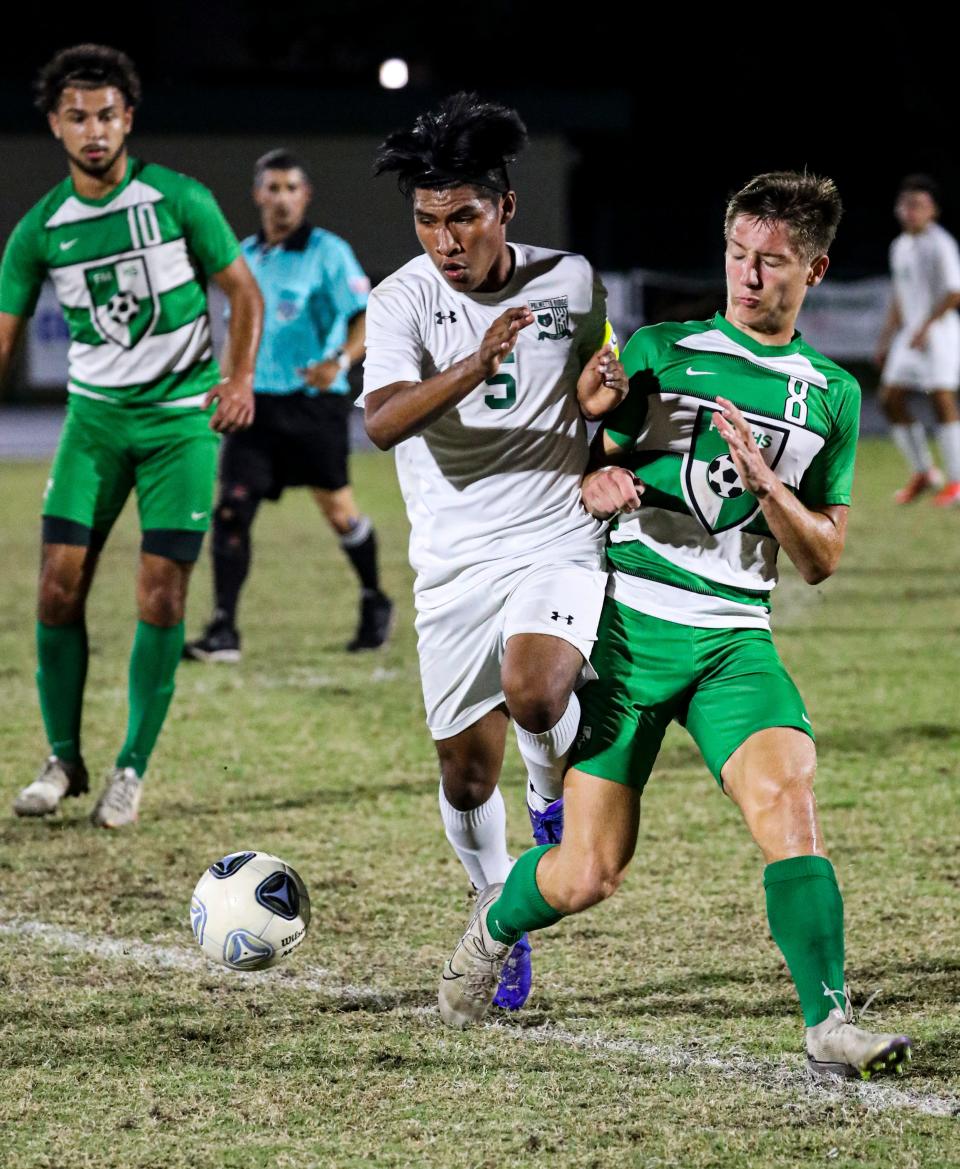 Michael  Krzeminski battles Palmetto Ridge is played Fort Myers for the Class 6A-District 8 title in boys soccer. Fort Myers won 2-1. 