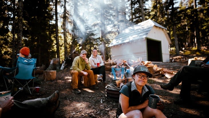 <span class="article__caption">Tired crew after a wood-hauling day at the Tilly Jane cabin. Andrea Chin up front.</span> (Photo: Eric Thornburg)