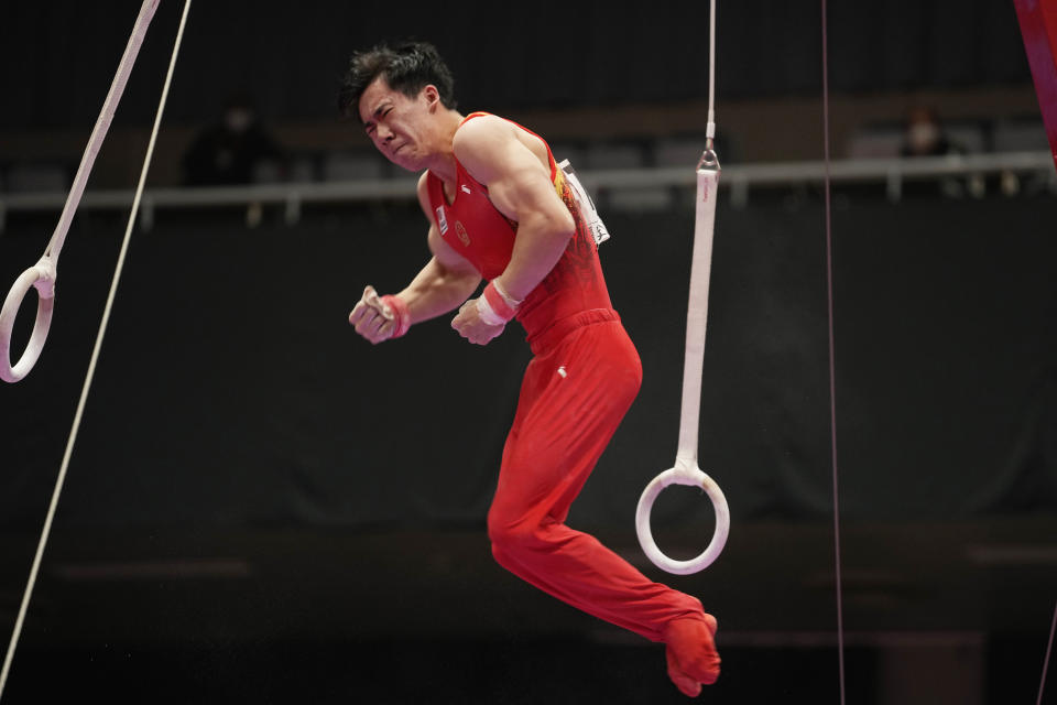 Zhang Boheng, of China, competes on the rings during the men's all-around finals in the FIG Artistic Gymnastics World Championships in Kitakyushu, western Japan, Friday, Oct. 22, 2021. (AP Photo/Hiro Komae)