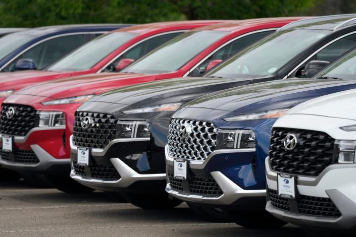 Hyundai SUVs at a car dealership.