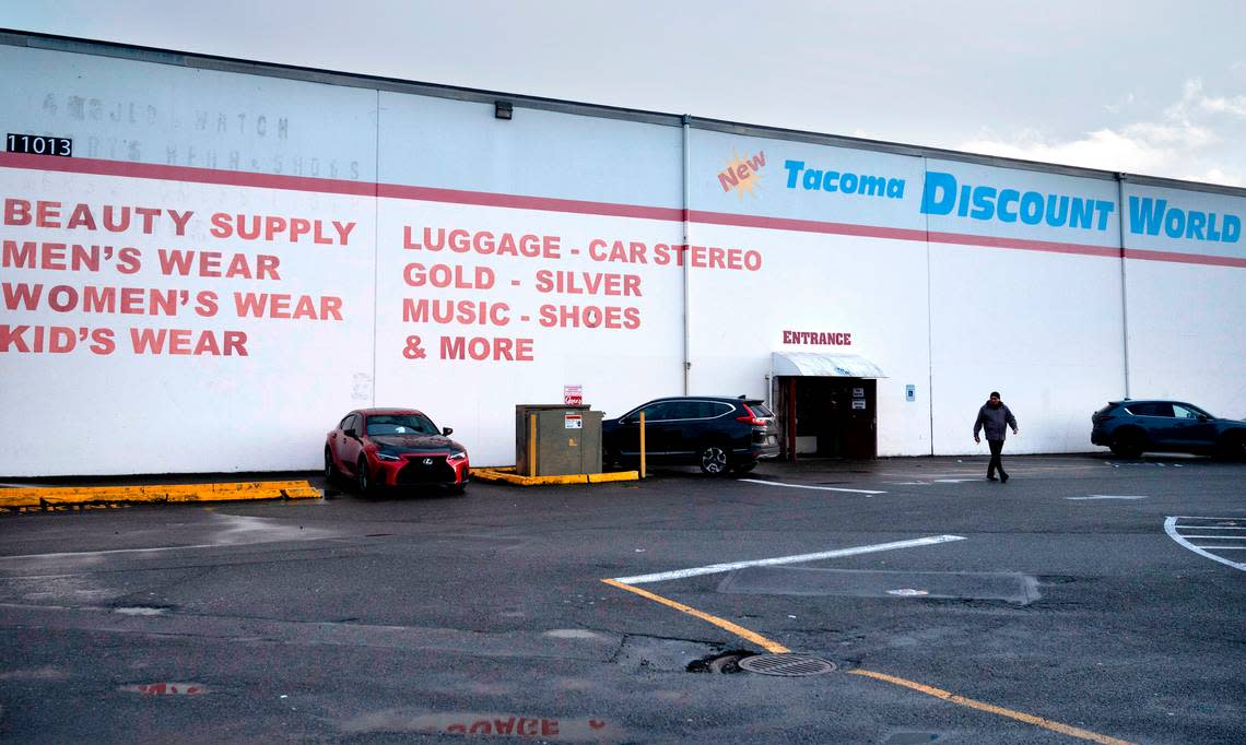 The Tacoma Discount World in Lakewood, Washington, is shown on Wednesday, Jan. 18, 2023. The building that hosts cooperative family markets will close at the end of April.