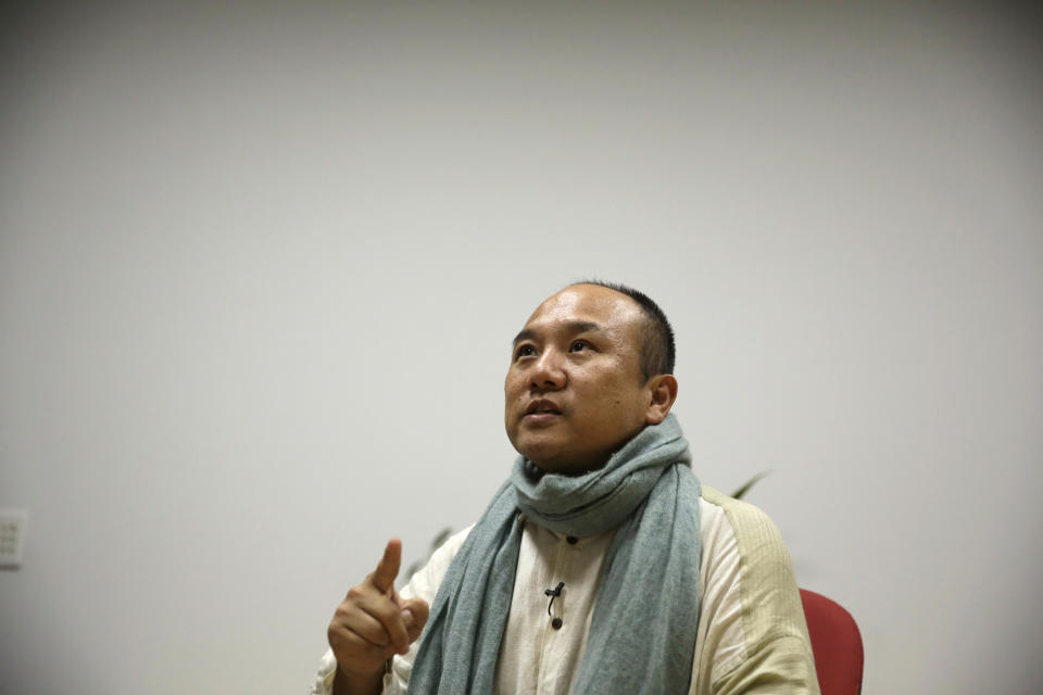 In this March 8, 2017 photo, Kazuo Sawato speaks during an interview in Tokyo. The 31-year-old Japanese office worker ran to the roof's edge and jumped. He landed on his legs, and initially regretted surviving. Now 42, Sawato says he is glad to be alive and wants to share his journey back to the world of the living with others who struggle under the societal pressure that make Japan one of the world's most suicide-prone societies. (AP Photo/Ken Moritsugu)