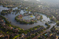 <p>Flood water surrounds homes in a residential neighborhood in the wake of Hurricane Harvey on August 29, 2017 in Houston, Texas. (Photo: Marcus Yam / Los Angeles Times via Getty Images) </p>