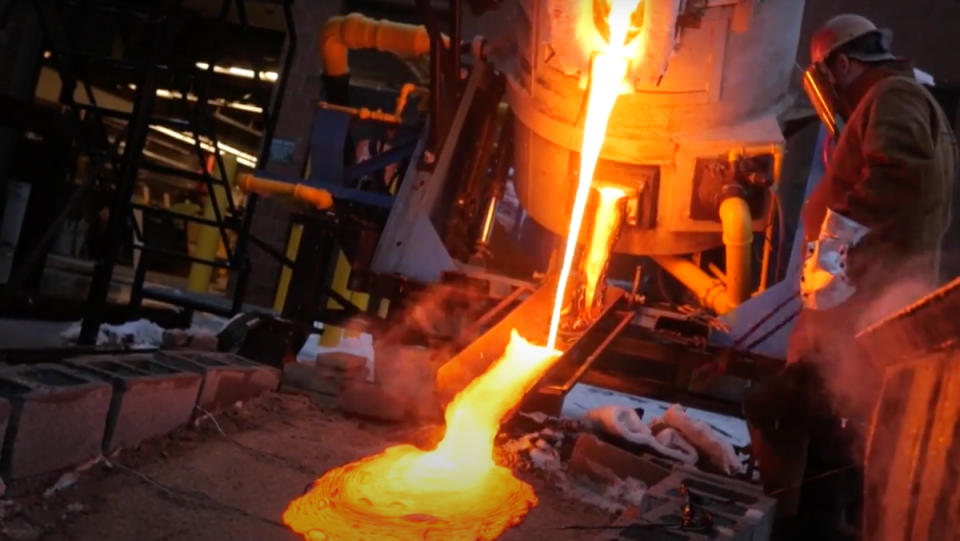 "Fake" 2,000°F molten lava pouring out of a blast furnace into white snow. 