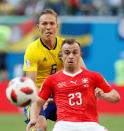 <p>Ludwig Augustinsson (L) of Sweden national team and Xherdan Shaqiri of Switzerland national team vie for the ball during the 2018 FIFA World Cup Russia Round of 16 match between Sweden and Switzerland at Saint Petersburg Stadium on July 3, 2018 in Saint Petersburg, Russia. (Photo by MB Media/Getty Images) </p>