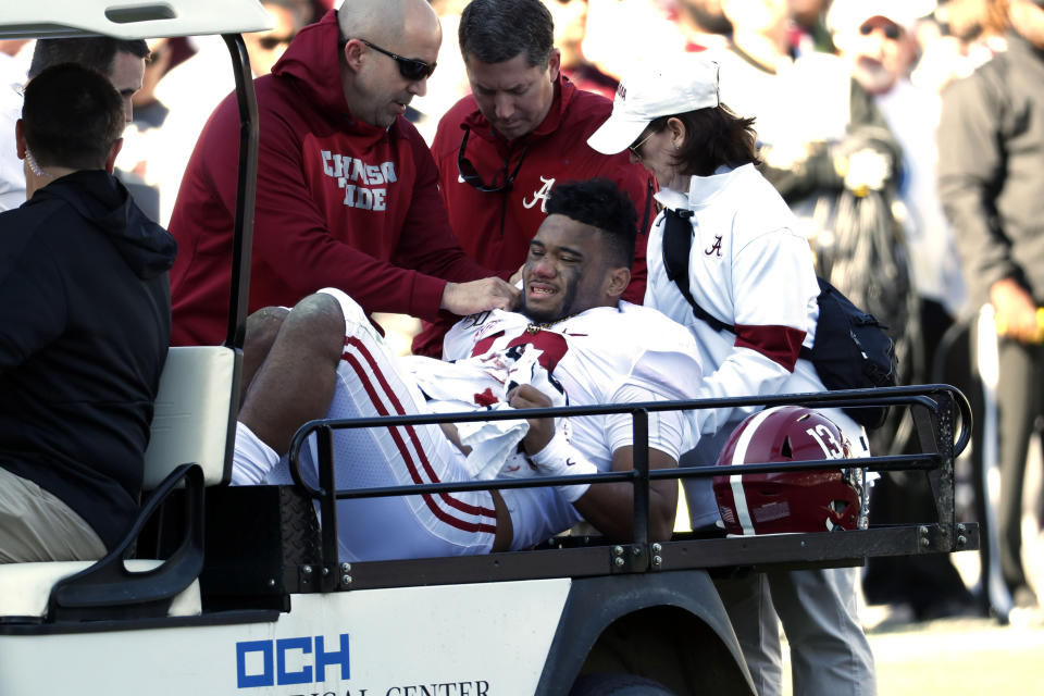 Alabama quarterback Tua Tagovailoa (13) is carted off the field after getting injured in the first half against Mississippi State on Saturday. (AP)