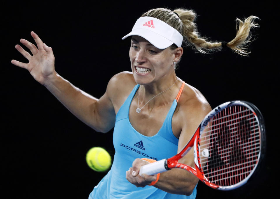 Germany's Angelique Kerber makes a forehand return to United States' Coco Vandeweghe during their fourth round match at the Australian Open tennis championships in Melbourne, Australia, Sunday, Jan. 22, 2017. (AP Photo/Dita Alangkara)