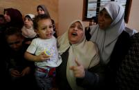 <p>Palestinians mourn during the funereal ceremony of Muhammed Dividar, martyred during clashes in Gaza the previous day, at Nuseirat refugee camp in Gaza City on May 15, 2018. (Photo: Ashraf Amra/Anadolu Agency/Getty Images) </p>