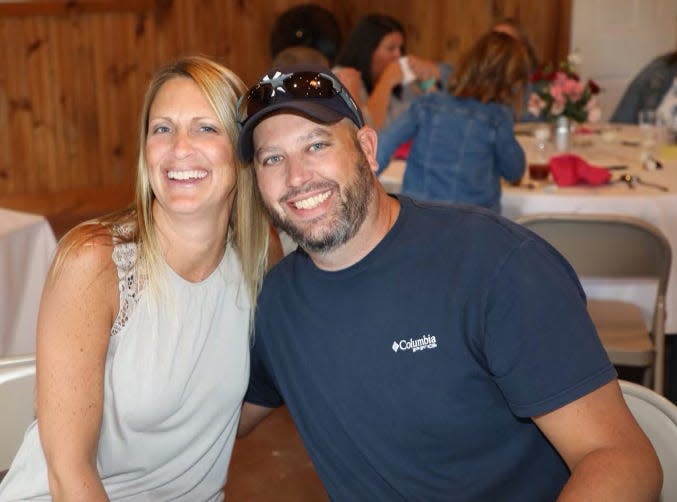 Jay Mills and his wife, Ami, pose for a photo at a friend's anniversary party in 2020.