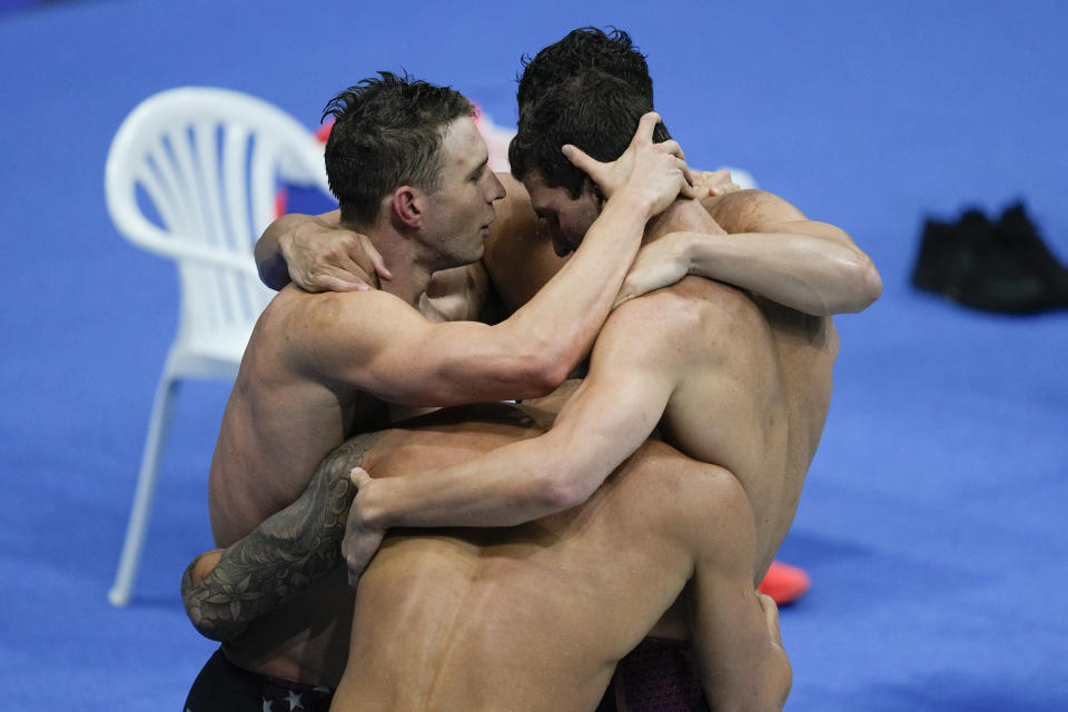 Members of the U.S. men's 4x100-meter medley relay team, Caeleb Dressel, Zach Apple, Ryan Murphy and Michael Andrew, celebrate after winning the gold medal at the 2020 Summer Olympics, Sunday, Aug. 1, 2021, in Tokyo, Japan. (AP Photo/Jae C. Hong)