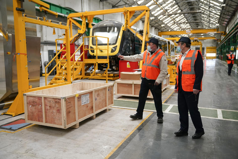 British leader of the Labour Party, Sir Keir Starmer (right) tours Alstom, formerly Bombardier, train manufacturers during a visit on 4 March in Derby, England. Photo: Christopher Furlong/Getty Images