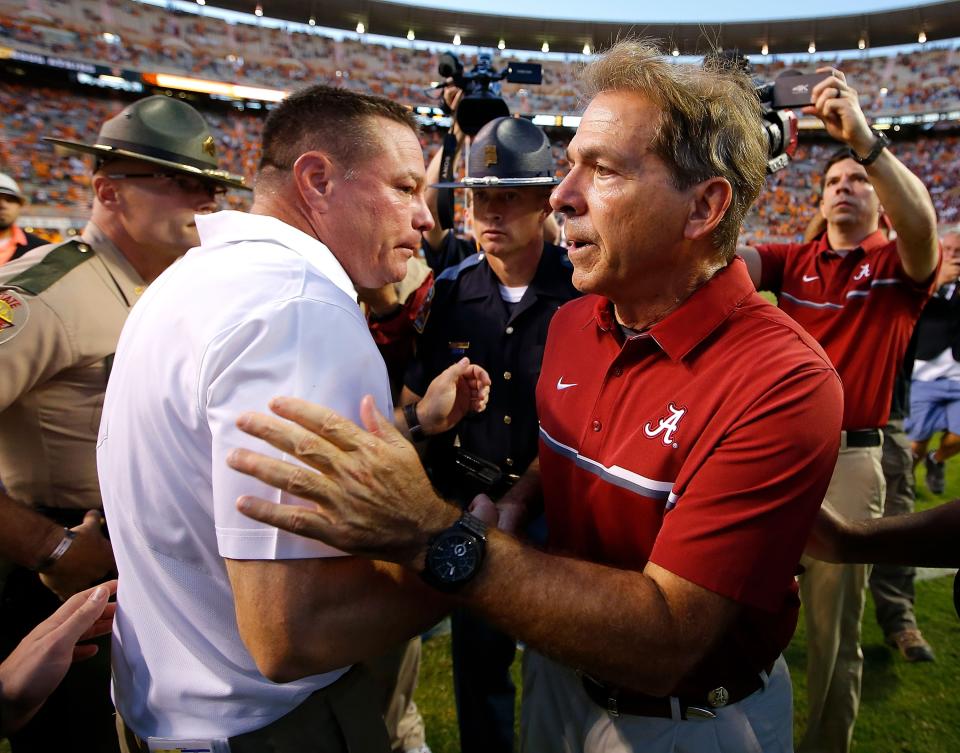 KNOXVILLE, TN – OCTOBER 15: Head coach Nick Saban of the Alabama Crimson Tide shakes hands with head coach Butch Jones of the Tennessee Volunteers after their 49-10 win at Neyland Stadium on October 15, 2016 in Knoxville, Tennessee. (Photo by Kevin C. Cox/Getty Images)