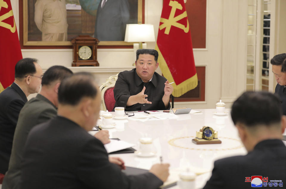 In this photo provided by the North Korean government, North Korean leader Kim Jong Un, center, attends a meeting of ruling party Workers' Labor Party of Korea in Pyongyang, North Korea Tuesday, May 17, 2022. North Korea on Wednesday, May 18, reported 232,880 new cases of fever and another six deaths as leader Kim Jong Un accused officials of “immaturity” and “slackness” in handling the escalating COVID-19 outbreak ravaging across the unvaccinated nation. Independent journalists were not given access to cover the event depicted in this image distributed by the North Korean government. The content of this image is as provided and cannot be independently verified. Korean language watermark on image as provided by source reads: "KCNA" which is the abbreviation for Korean Central News Agency. (Korean Central News Agency/Korea News Service via AP, File)