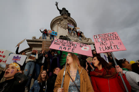 Women attend a demonstration at the Place de la Republique during a protest to highlight the pay disparity between women and men, in Paris, France, March 8, 2019. REUTERS/Philippe Wojazer
