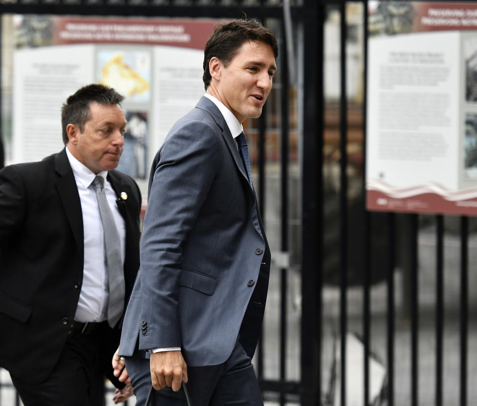 Canadian Prime Minister Justin Trudeau arrives on Parliament Hill in Ottawa, Ontario on Monday, Oct. 1, 2018. The U.S. and Canada reached the basis of a free trade deal Sunday night, a senior Canadian government official said. (Justin Tang/The Canadian Press via AP)