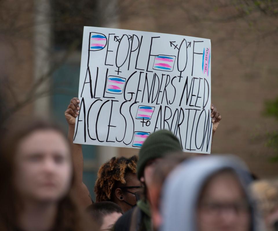 Protestors held signs and chanted during a rally for reproductive rights at Kent State University on Thursday.