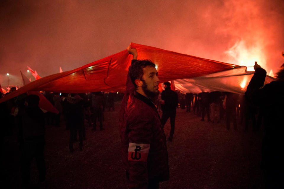 <p>Man holds big Polish flag during Independence March in Warsaw, Poland on Nov. 11, 2017. (Photo: Maciej Luczniewski/NurPhoto via Getty Images) </p>